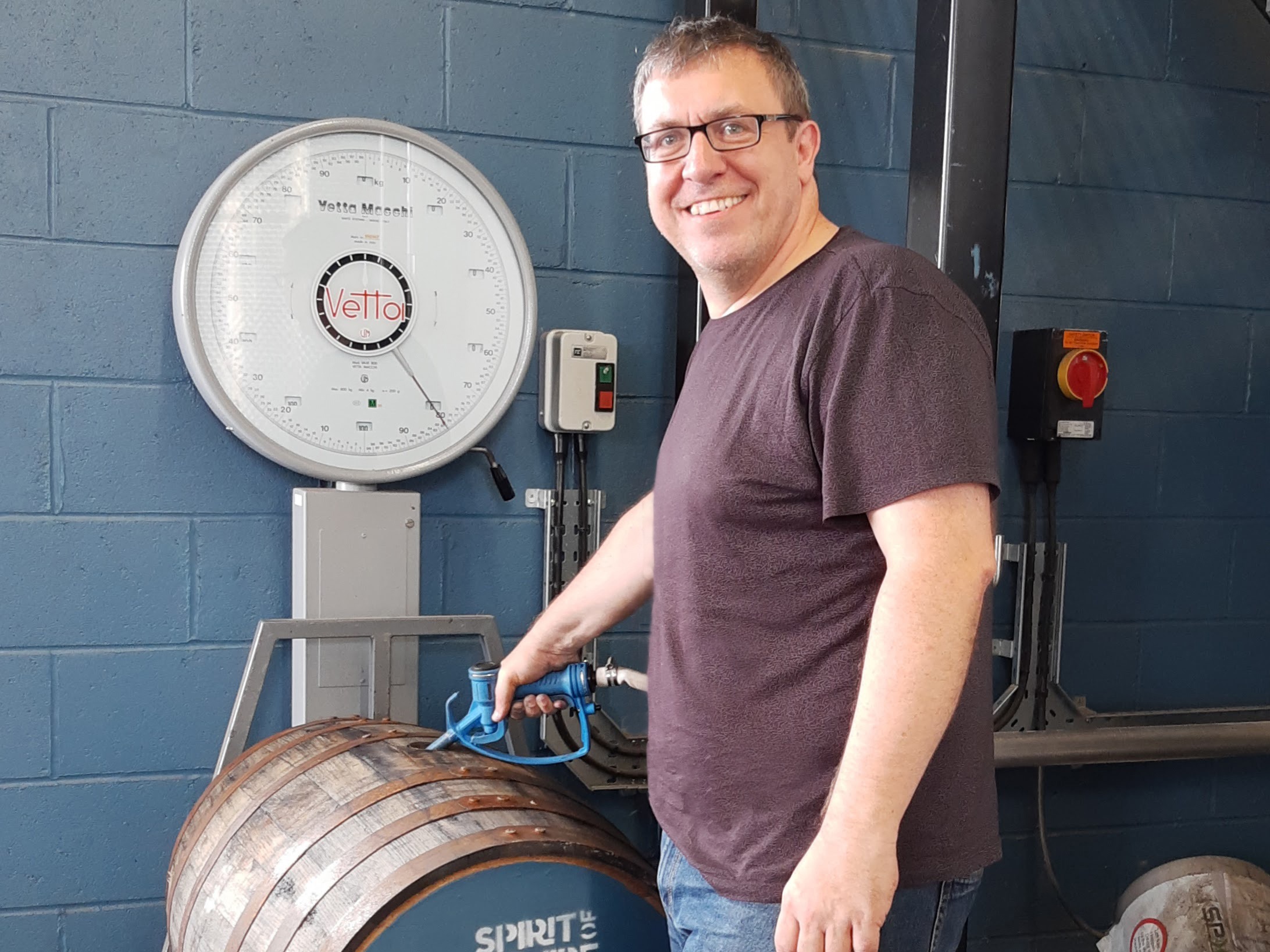 Rob fills a cask of whisky at Spirit Of Yorkshire Distillery.